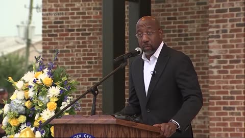 Senator Raphael Warnock speaks at Georgia vigil mourning victims of mass school shooting