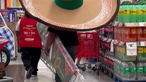 Man Dons a Giant Sombrero