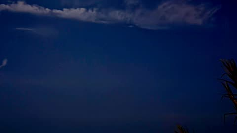 Moonlit Ocean: A Serene Night Under the Clouds