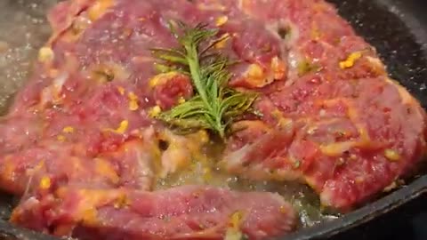 Golden Beef Steak with Rosemary Fried in Natural Butter Sizzle