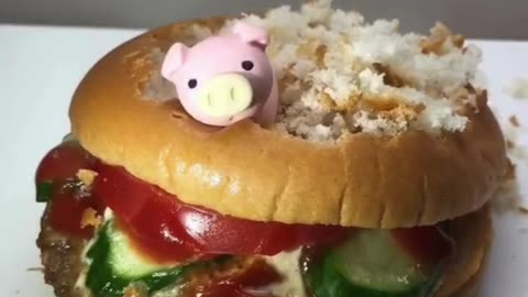 Watch: Toy Pig Eats a Huge Burger—AI Fun in Action! 🐷🍔