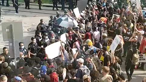 Protesters turne violent in downtown houston destroying a police car