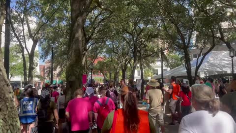 Protestors gather near TPUSA’s Student Action Summit, and plan to march to the event’s location at the Tampa Convention Center