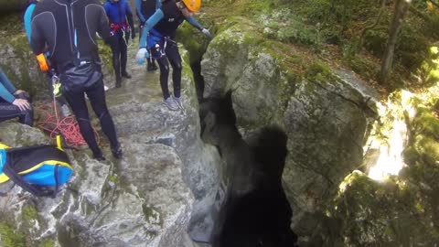 A man falls into water in a canyon ops