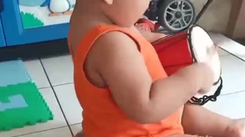 Baby playing drum