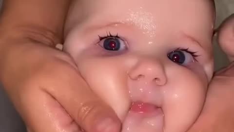 Cute baby taking bath