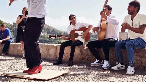 Group of Men Singing and Dancing Flamenco in Granada Spain.