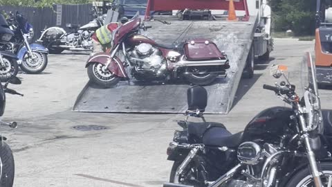 Tow Truck Drags Motorcycle Up Ramp