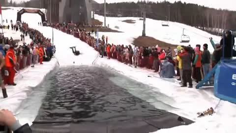 Daredevils try to ski over ice cold puddle in Russia