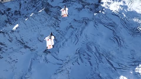 2 Wingsuit Flyers BASE Jump Into a Plane In Mid-Air | A Door In The Sky