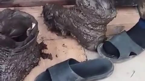 Ukrainian soldier taking off his boots after 5 days in trenches