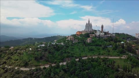 aerial skyline of barcelona from tibidabo mountain