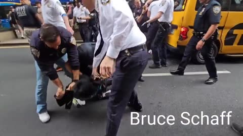 NYPD officers smashing someone’s face through a car windshield