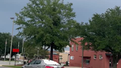 Guy Rides on Car Hood