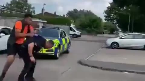 An immigrant attacks a British police officer.