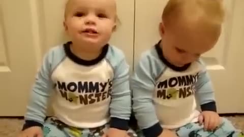 Twin Baby talking with Mommy