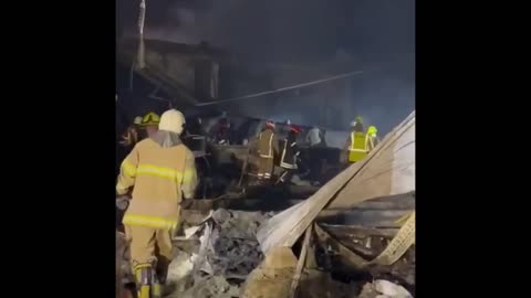 RESCUERS CONTINUE CLEARING UP THE RUBBLE OF WHAT USED TO BE AMSTORE SHOPPING CENTER IN KREMENCHUK