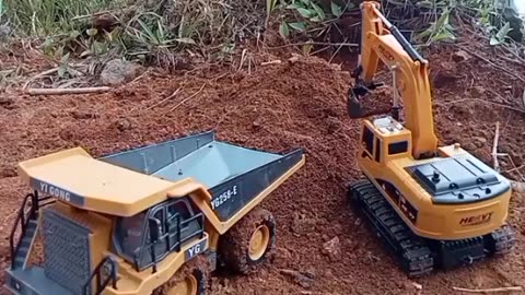 Digging excavator and giant mining truck