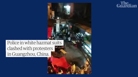 Protesters clash with hazmat suit-clad riot police in Guangzhou, China