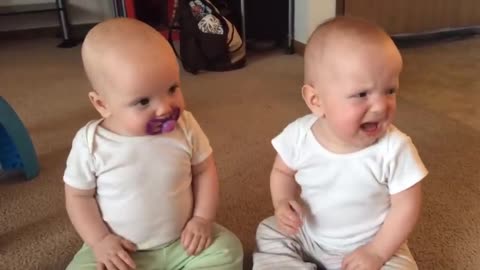 Twin Baby girls fight over pacifier