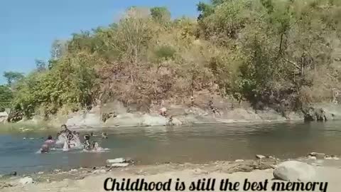 Father and Kids having Fun At the Riverbanks