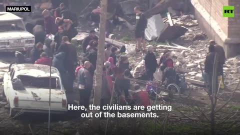 Evacuated civilians greet Russian troops and media after weeks in basements near Azov Steel plant