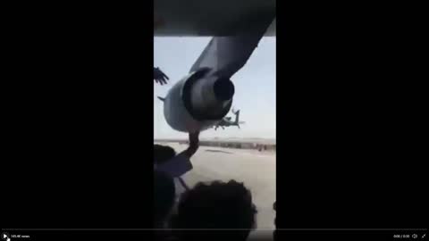 Afghanis taking off with USAF plane, OUTSIDE THE PLANE