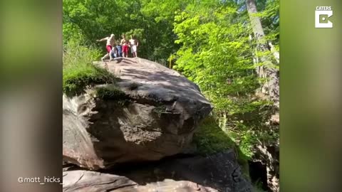 Incredible 73-year-old grandpa jumping off a 50 foot cliff into a pool