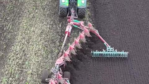 Turning over the soil with this huge plough