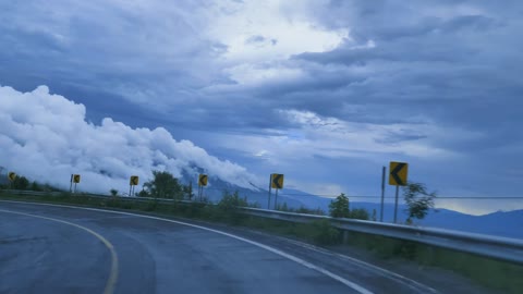 Going down a curved highway down a mountain