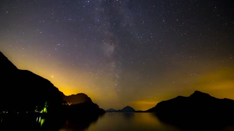 The colors of Aurora in the sky on a starry night