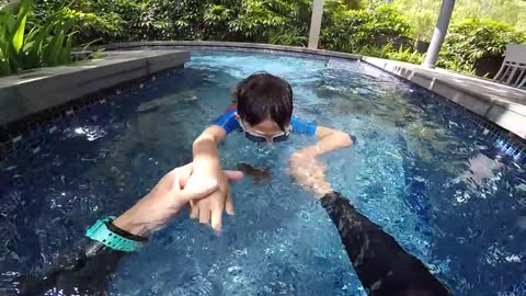 Kid learning to swim