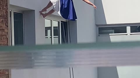 Woman Dances On Wall Side