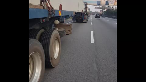 Sketchy Motorcycle Maneuver Under Semi Truck