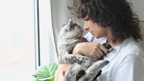 Woman Cuddling Her Cat