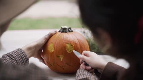 People Carving a Pumpkin , Halloweens Event