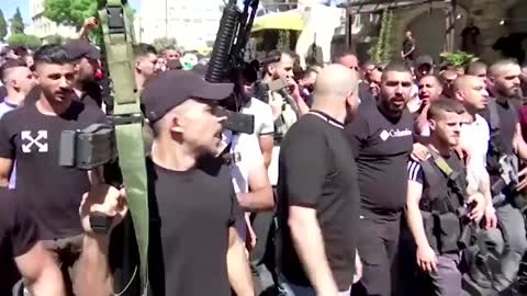 Palestinians attended a funeral procession for two gunmen killed earlier in the day by Israeli