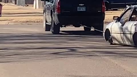 SUV Drags along Tireless Car