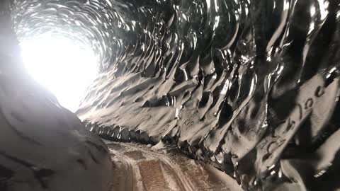 Exploring a Beautiful Naturally Crafted Ice Tunnel