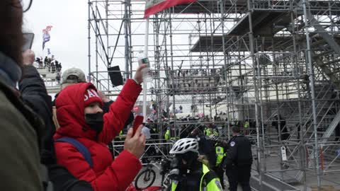 Man at the capitol building expressing his love for the cop