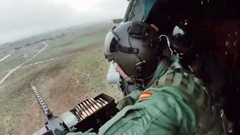 Loading machine gun in helicopter