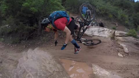 Mountain biker has an epic faceplant