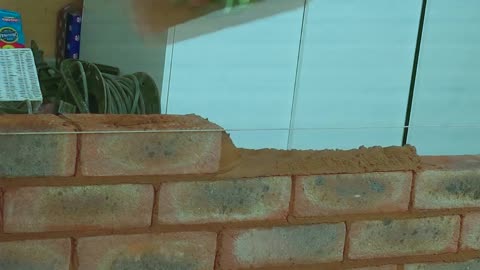 bricking up garage door into window - brickaying