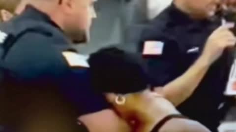 COP PUNCHES WOMAN IN THE FACE