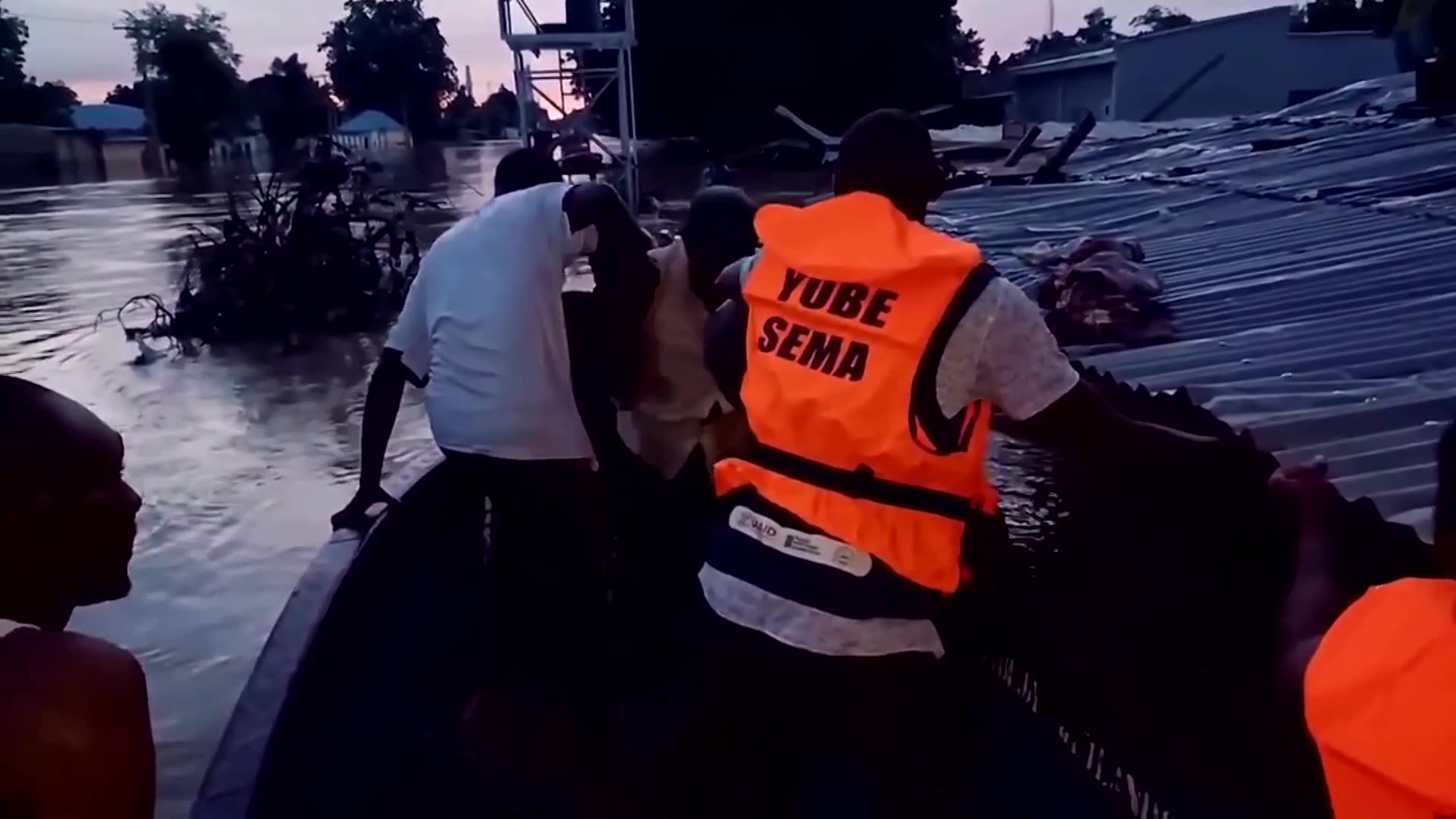 Rescuers help people off rooftop as floods hit Nigeria