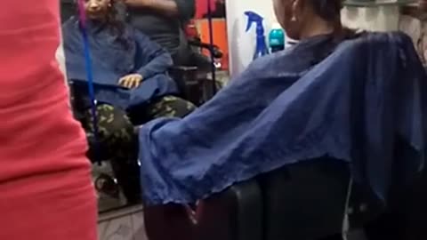 Young Indian girl headshave at barbershop 2024