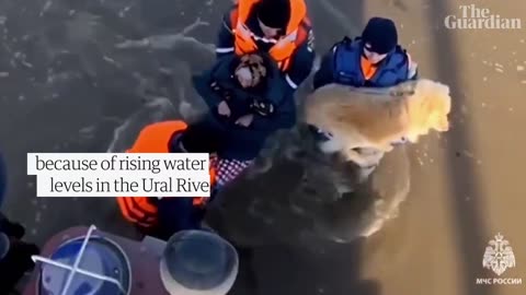 People carried out of flooded homes after Russia’s Orsk after dam break