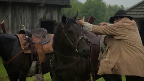 Law Man Mounts Horse In Rain Storm