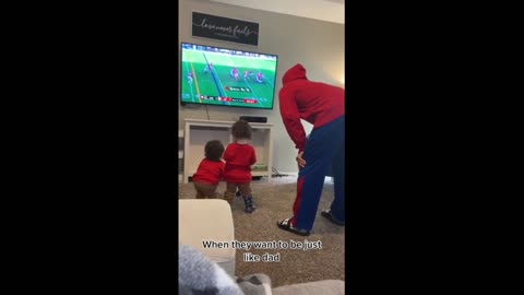 Toddlers adorably imitate their dad watching football gam https://www.youtube.com