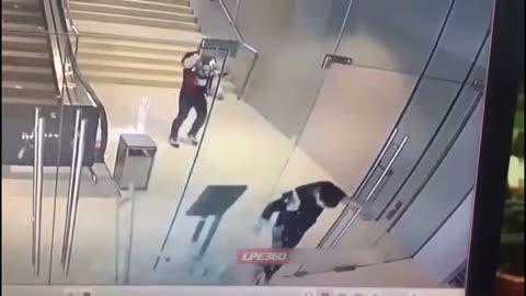 Man runs into and shatters glass door